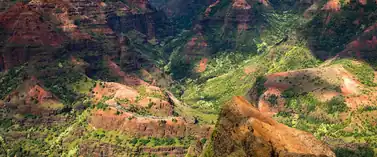 Red and green eroded ridges of Waimea Canyon on Kauai, Hawaii
